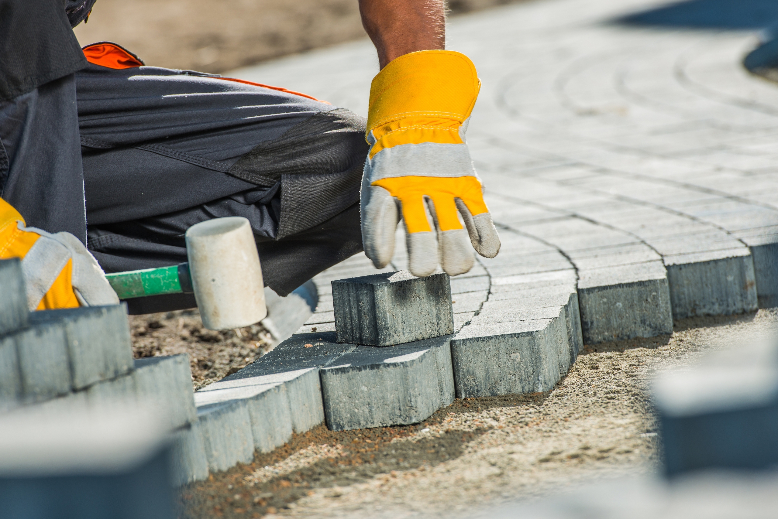 Close-up of drainage channel integration near new paving in Northern Suburbs.